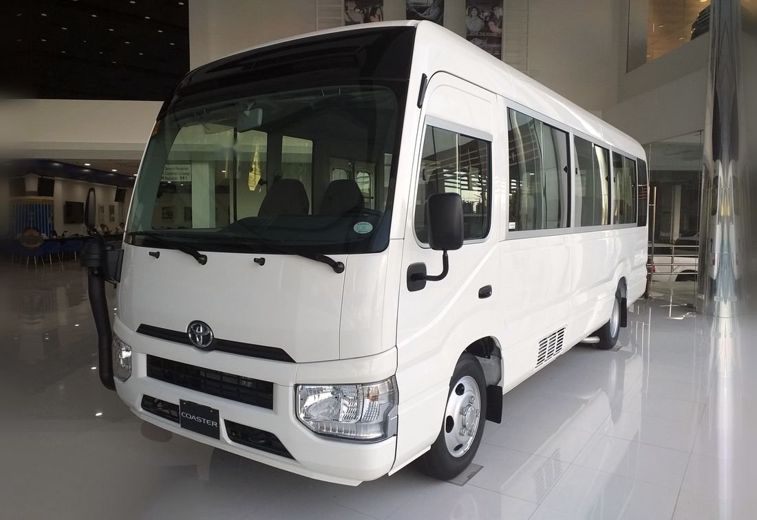 White Toyota Coaster mini coach