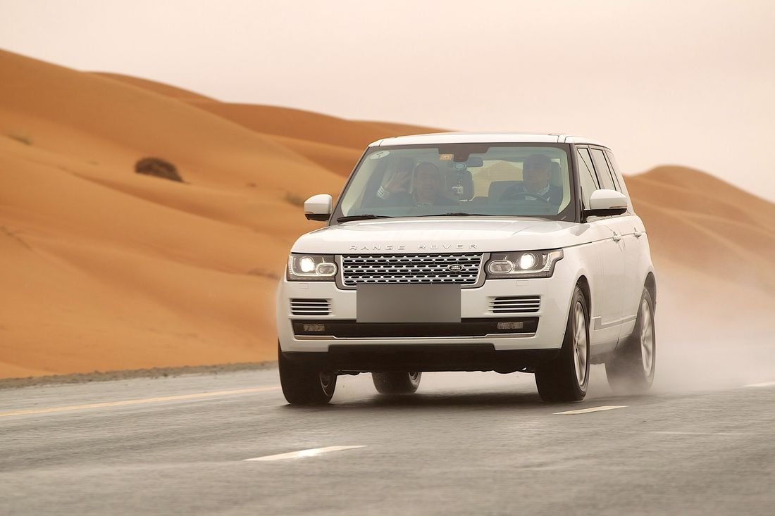 Luxury SUV on a desert road outside Abu Dhabi