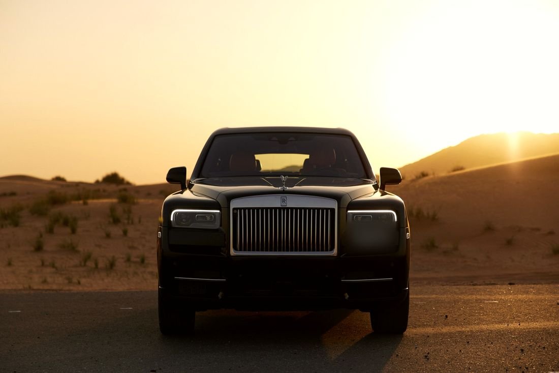 Rolls-Royce in the desert at sunset